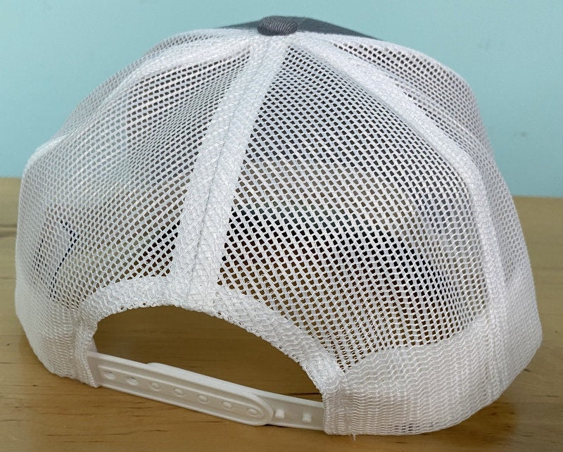 Trucker Hat with embroidered cross side placement