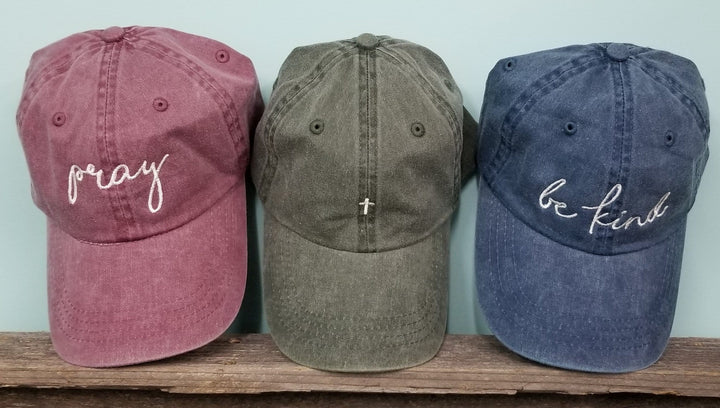 Christian saying pigment dyed dad hat, baseball handwritten. Pray, Be Kind, Cross-Faith dad cap, maroon, forest, navy. Embroidered cross hat